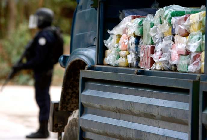 Senegalese Policeman Stands In Front Of A Truck Loaded With Cocaine To Be Destroyed Just Outside The Capital Dakar
